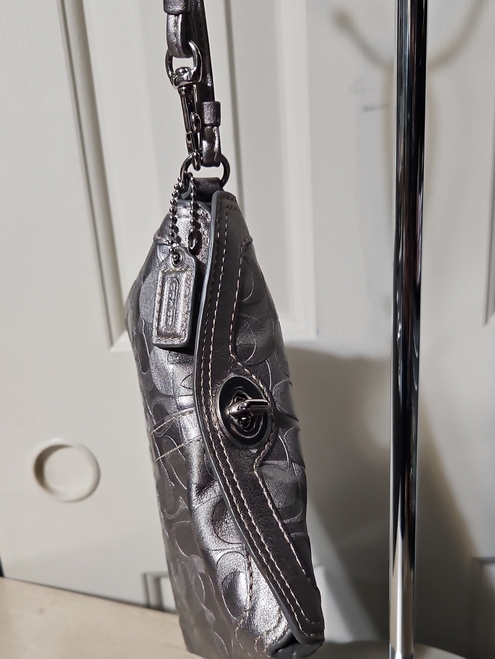 Coach NWOT Y2K Metallic Silver Turnlock Signature Leather Wristlet